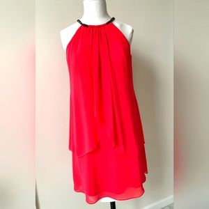 Coral pink flowly and feminine sun dress with beaded neckline.